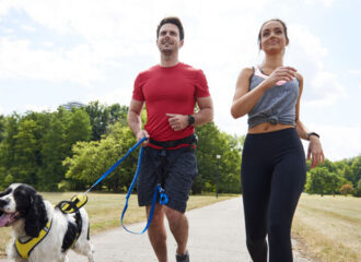 couple running with dog